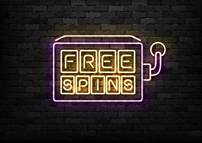 neon sign that reads free spins